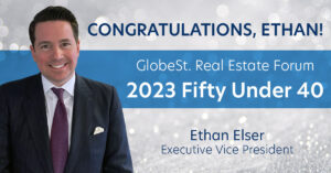 Image of Ethan Elser congratulating him for Fifty under 40 award