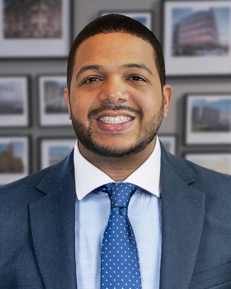 Man in suit with blue tie.